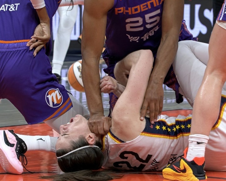 Caitlin Clark on the court after hard contact during a WNBA game — a father’s heart watching his daughter compete