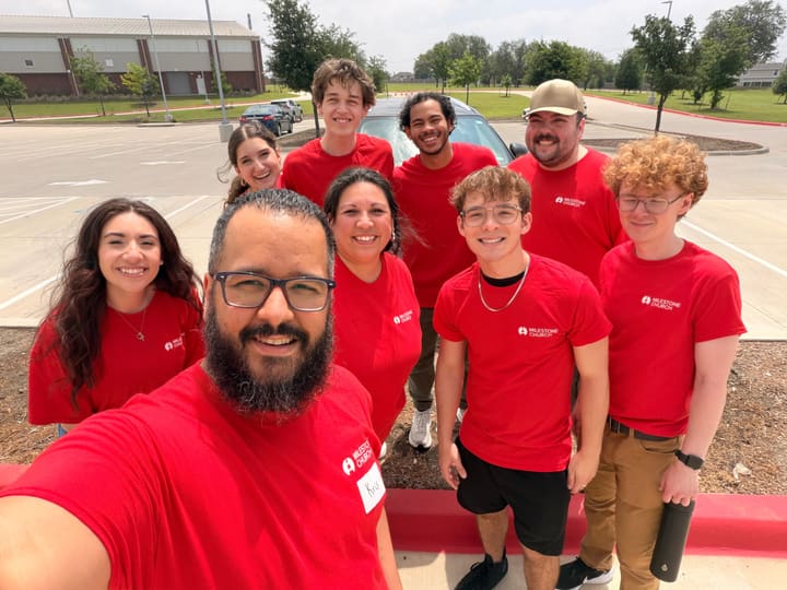 Milestone Church prayer team in matching red shirts outdoors